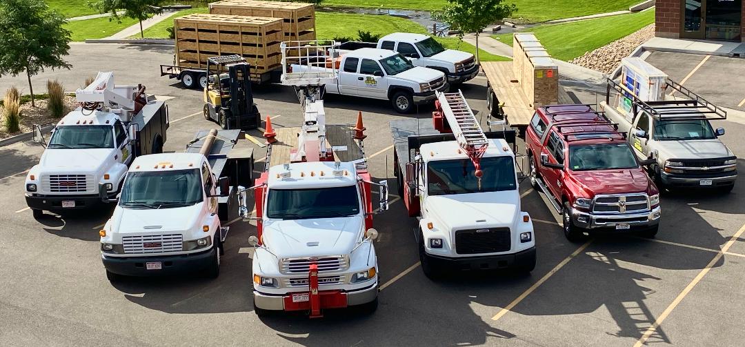 Custom Lighted Signs fleet of crane trucks and service vehicles