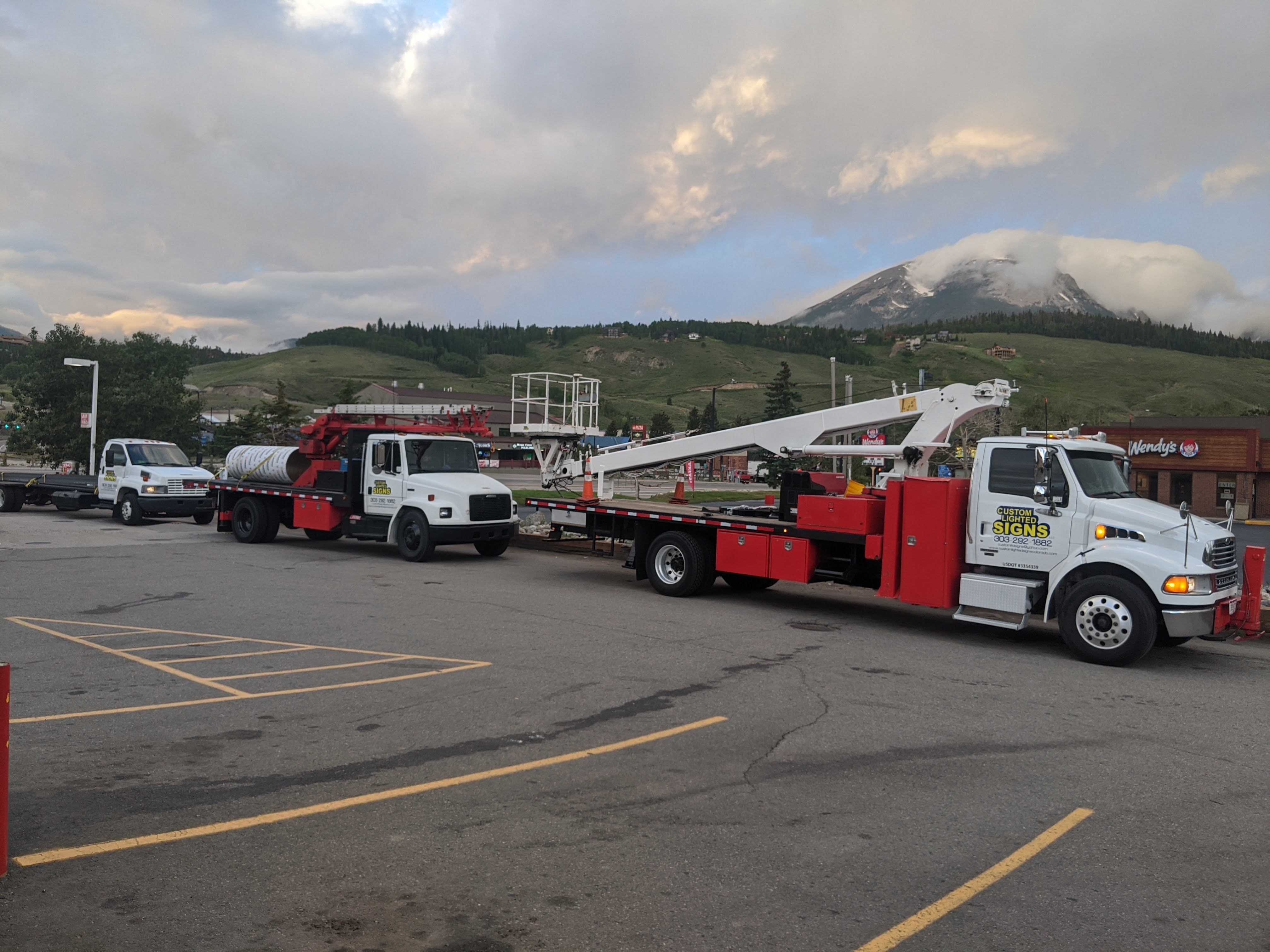 Sign installation crew at work on a commercial project